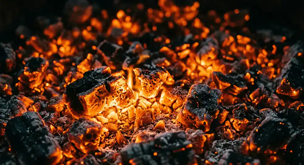 Close up texture of burning orange embers