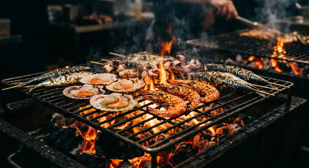 Close up of fresh seafood cooking directly over an open flame grid
